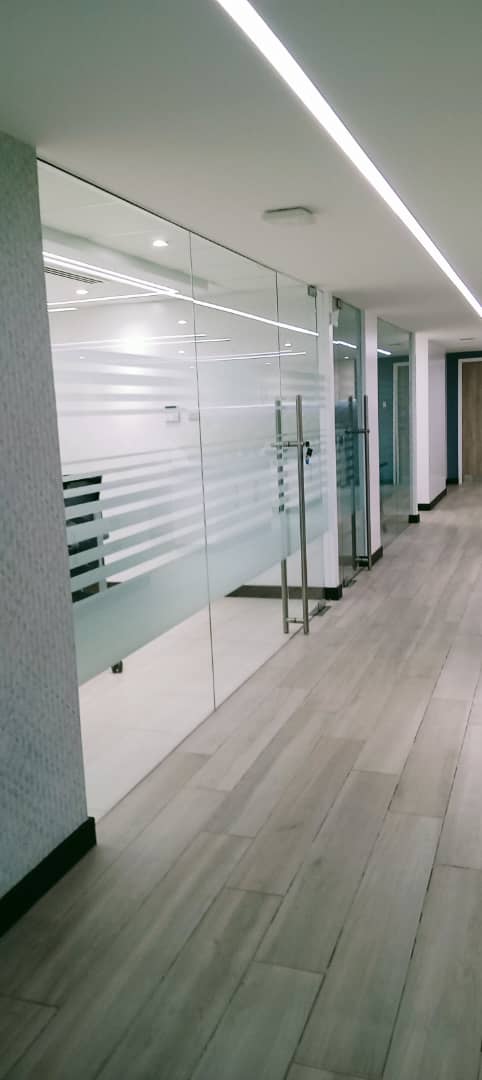 Frosted window film applied to office glass partitions