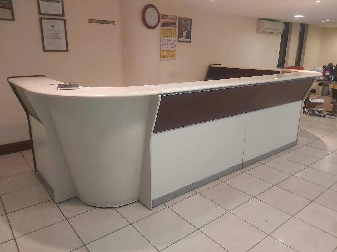 Custom-fitted reception desk installed by Dyeka Soars Enterprises